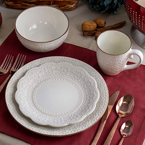 Elama Contessa ivory stoneware place setting on a red placemat with bowl, mug, plates and copper flatware