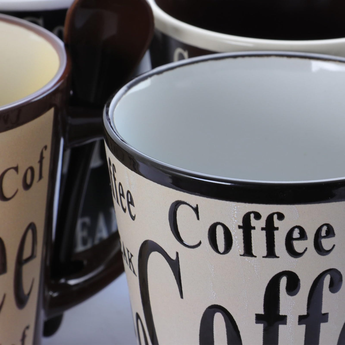 Mr. Coffee Bareggio Stoneware Coffee Mugs with Matching Spoons, Set of 4, 13 Oz, Embossed Reactive Glaze, Assorted Designs