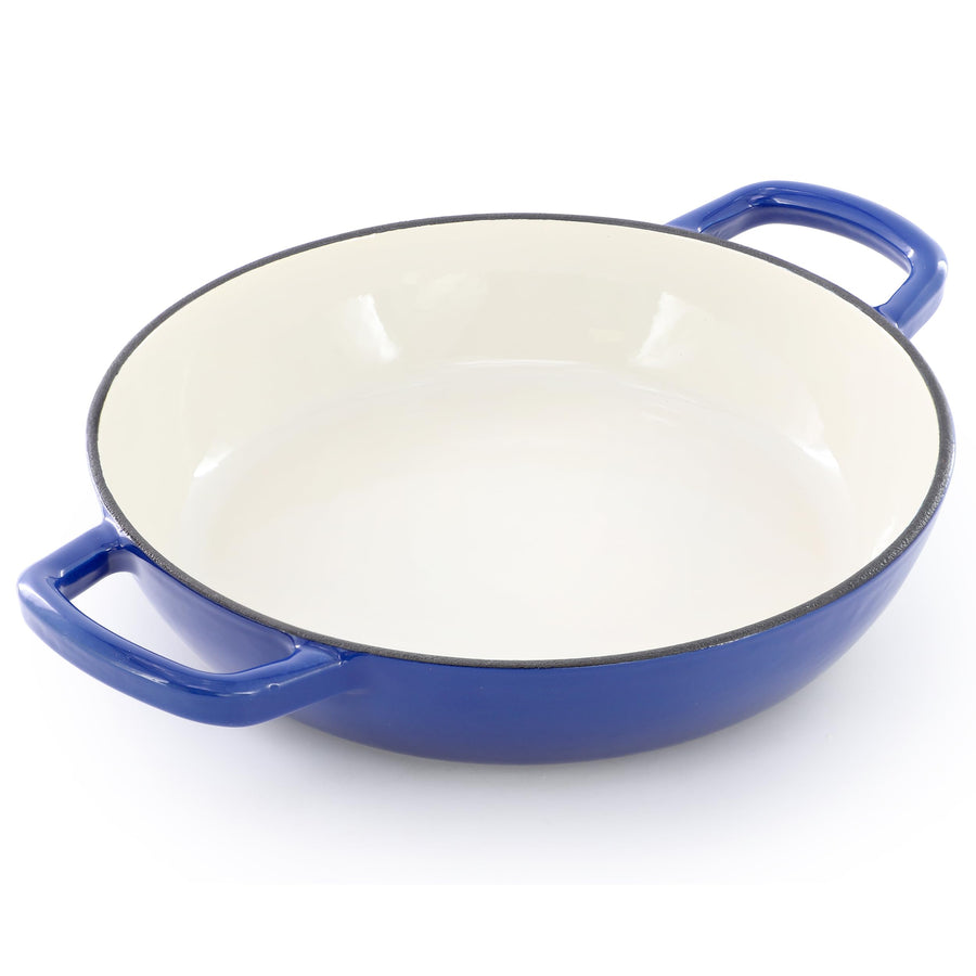 Shallow base of the blue enameled cast iron bread pot with cream enamel interior