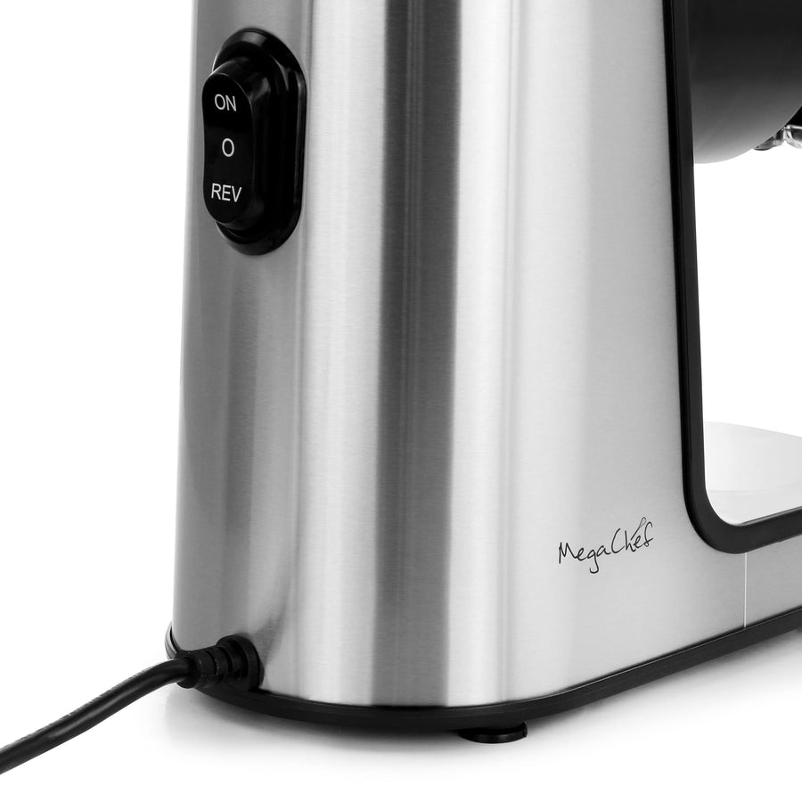 Close-up of the MegaChef slow juicer ON, off and REV reverse switch on the brushed stainless steel housing