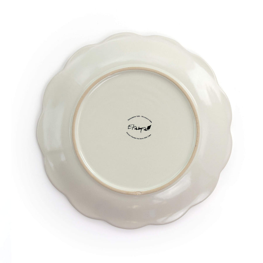 Underside of the Elama Contessa scalloped salad plate showing the dishwasher and microwave safe backstamp