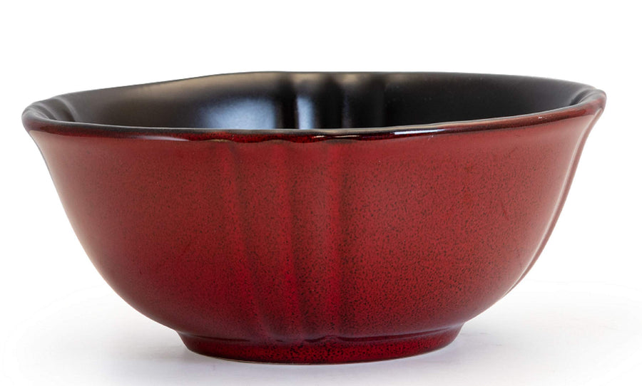Elama Regency red stoneware bowl from the side, scalloped fluted shape with a black glazed interior