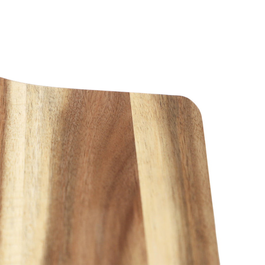Close up of acacia wood grain on the pizza peel edge