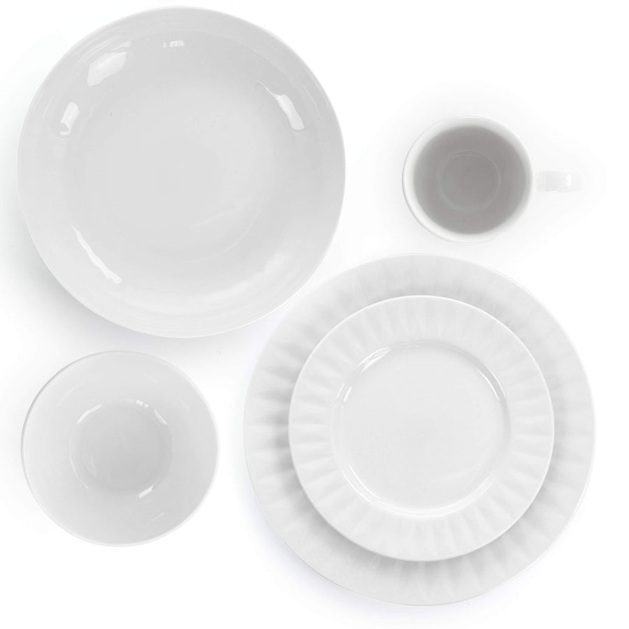Overhead view of Elama Sienna white porcelain serving bowl, cup, bowl, dinner plate and dessert plate