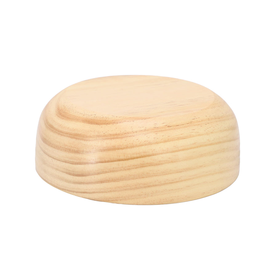 MegaChef 7 inch light acacia wood bowl turned upside down, showing the flat base and natural grain on the side