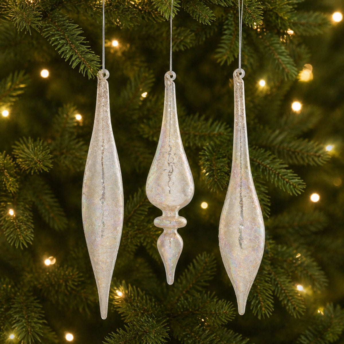 Champagne Jeweled Glass Drop Finial Christmas Ornaments hanging on a Christmas tree, holiday decor styling idea