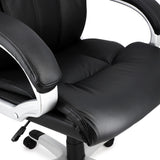 Close-up of the Elama black faux leather office chair seat cushion and padded armrest with silver-finish frame