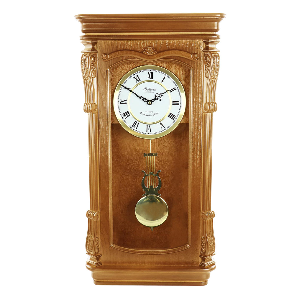 Bedford Clock Collection Golden Oak Chiming Pendulum Wall Clock – Quartz Westminster Chimes, Golden Accents with Swinging Pendulum & Roman Numeral Dial