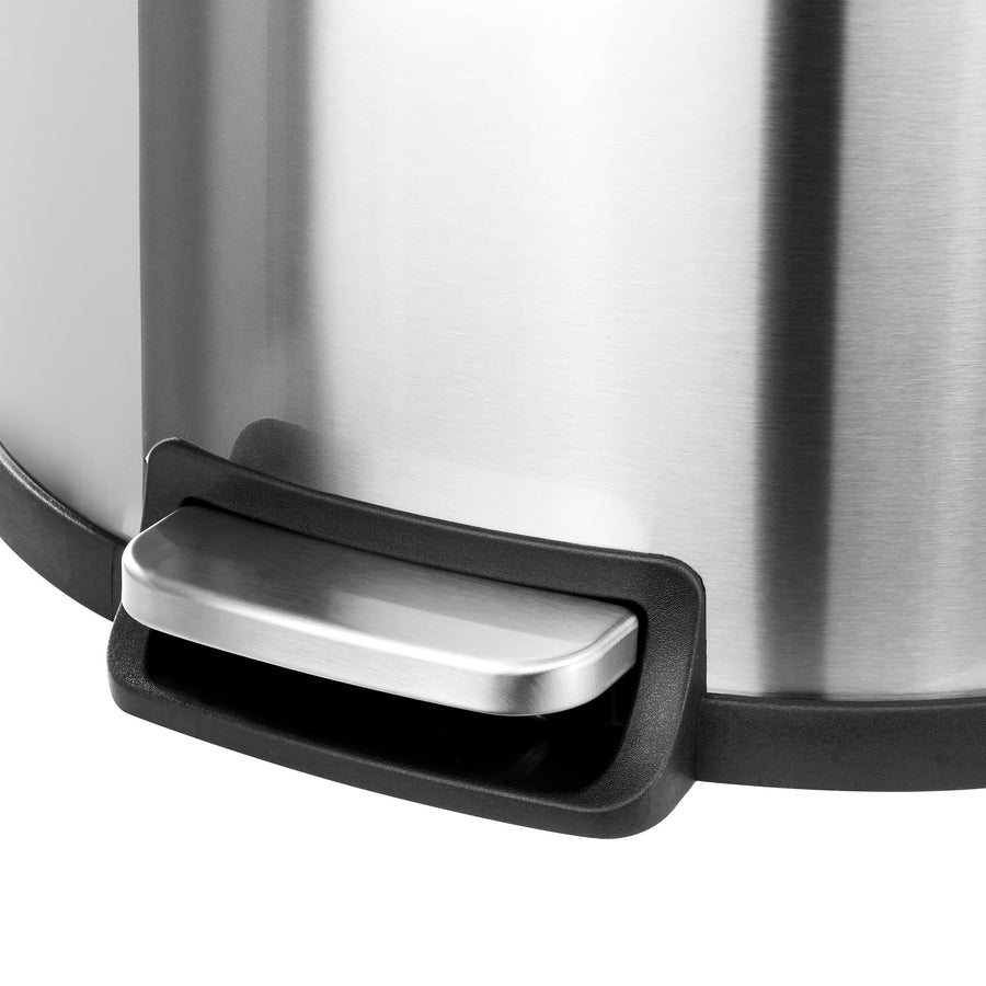 Close up of the foot pedal on the half-circle step trash can