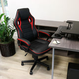Elama black and red high back office chair, lifestyle at a home office desk with a plant and keyboard tray