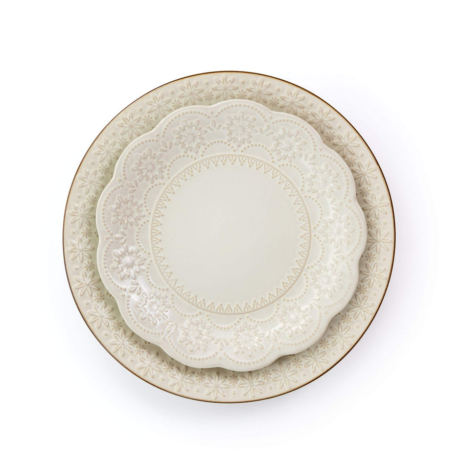 Top view of the Elama Contessa scalloped ivory salad plate stacked on the embossed stoneware dinner plate