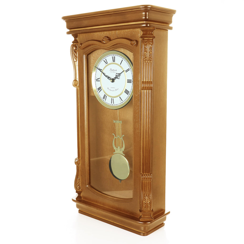 Bedford Clock Collection Golden Oak Chiming Pendulum Wall Clock – Quartz Westminster Chimes, Golden Accents with Swinging Pendulum & Roman Numeral Dial