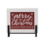 Small white and red wood sign reading Merry Christmas, Happy New Year on a stand