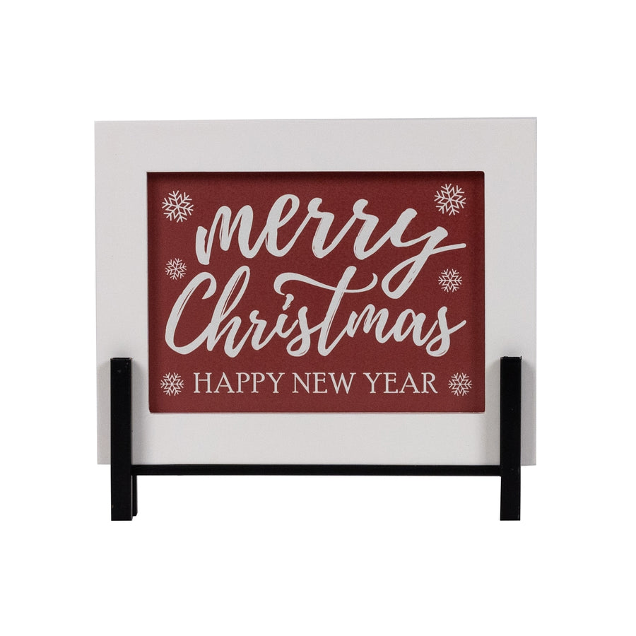 Small white and red wood sign reading Merry Christmas, Happy New Year on a stand