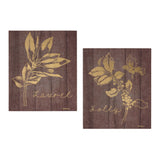 Two wall plaques with gold holly and laurel artwork on a rustic wood look background