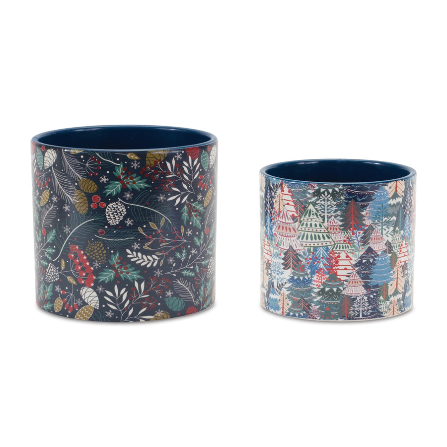 Four blue and white dolomite holiday planters with pinecone, berry, and pine tree designs in two sizes