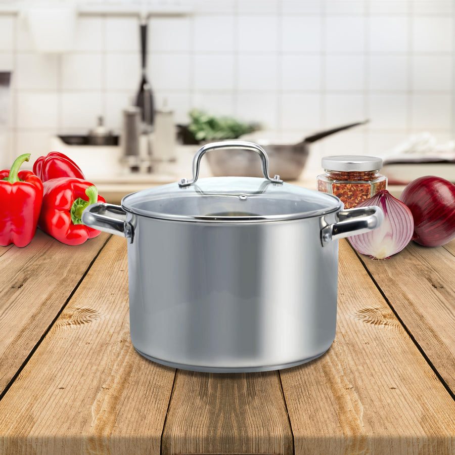Oster Adenmore stock pot on a kitchen counter with vegetables