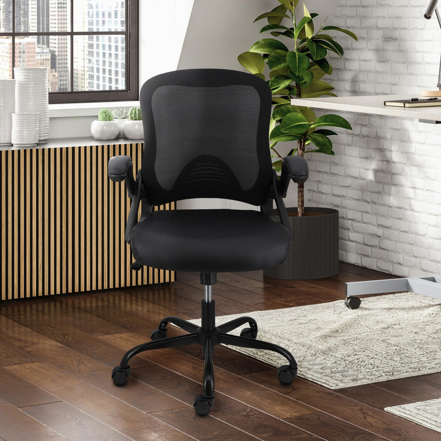 Elama black compact mesh office chair, lifestyle in a home office with wood floors, a rug and a plant
