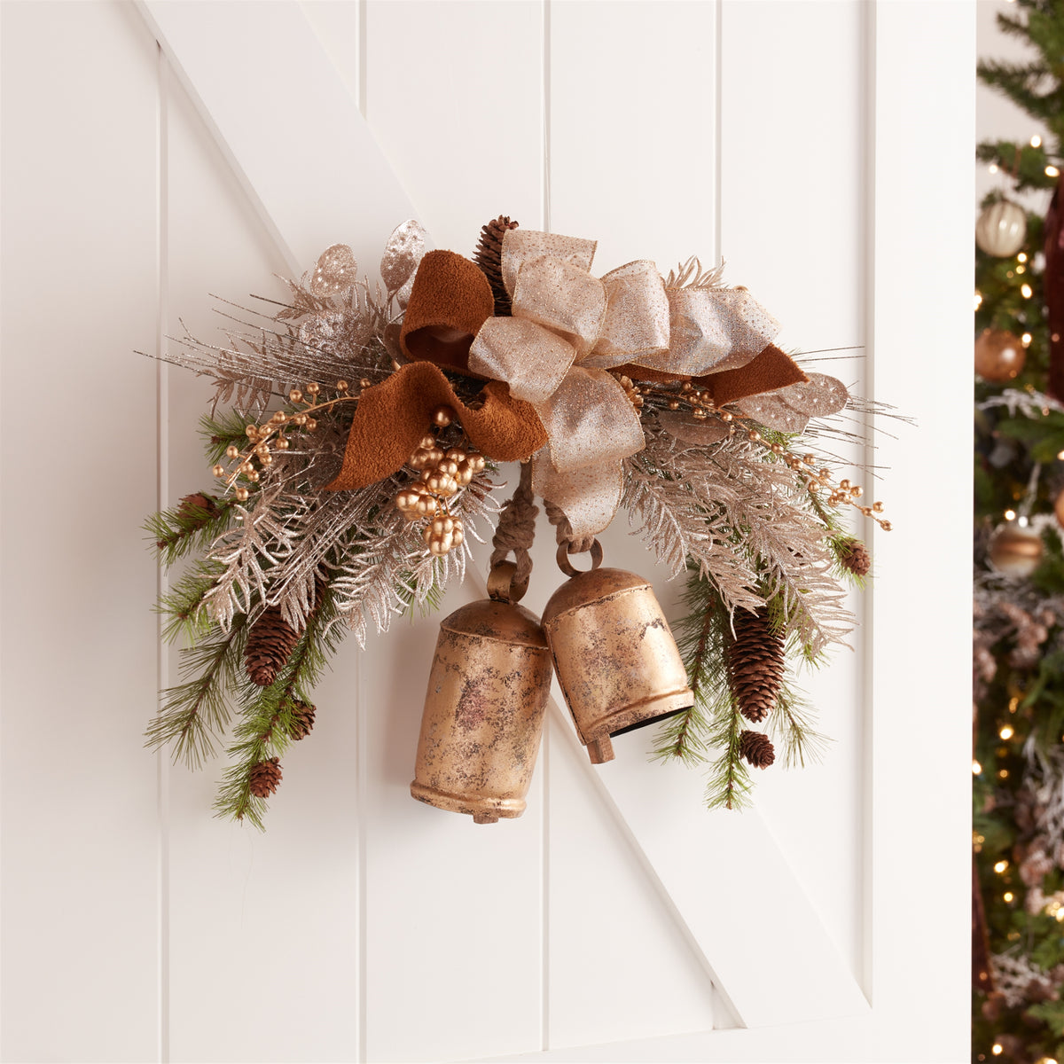 Distressed Gold Cone Bell Christmas Ornaments hanging on a Christmas tree, holiday decor styling idea