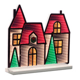 Winter Village EkkoLight house display in red with pine tree accents glowing with an infinity light effect