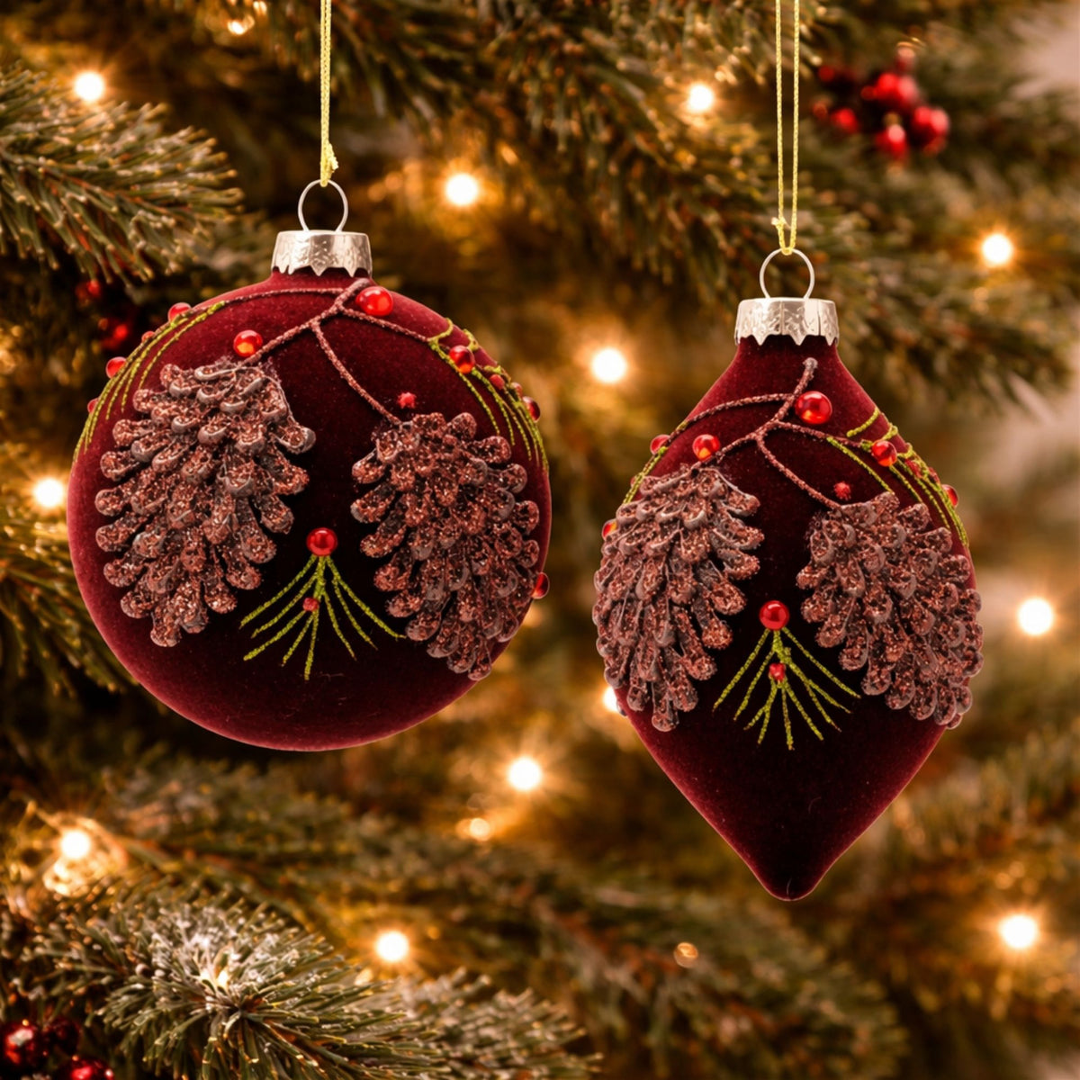 Burgundy Velvet Glass Ball and Drop Christmas Ornaments hanging on a Christmas tree, holiday decor styling idea