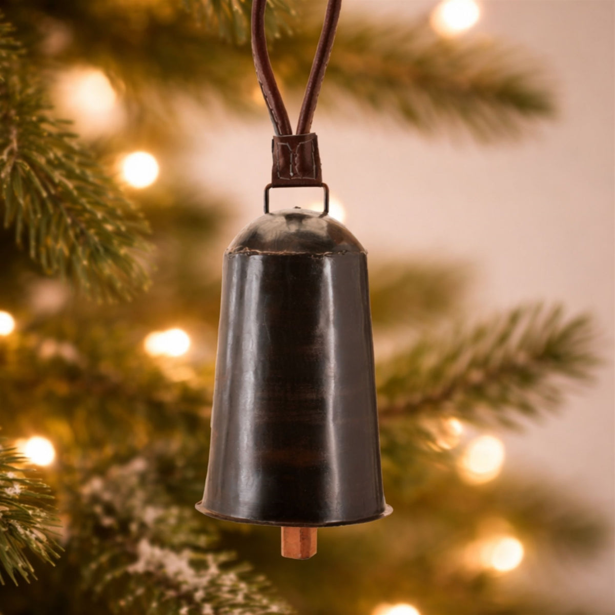 Black Iron Hanging Bell Christmas Ornaments hanging on a Christmas tree, holiday decor styling idea