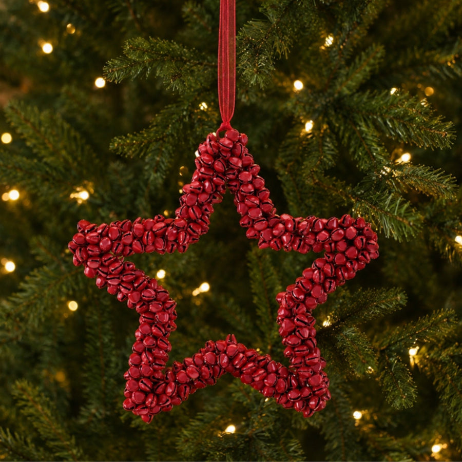 Red Iron Bell Star Christmas Ornaments hanging on a Christmas tree, holiday decor styling idea