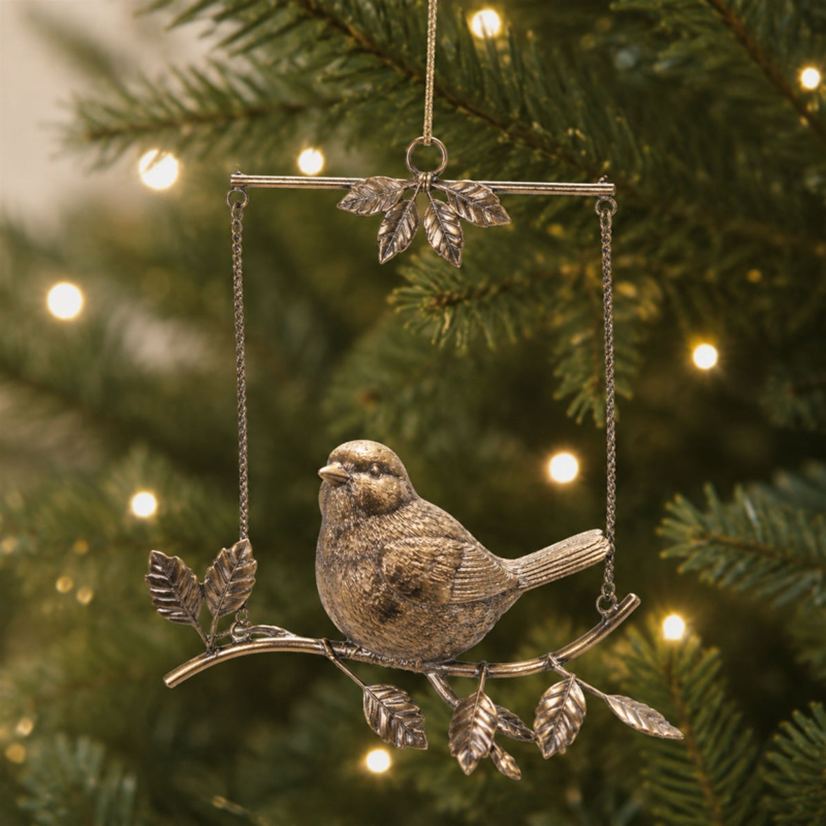 Bird on Branch Christmas Ornaments hanging on a Christmas tree, holiday decor styling idea