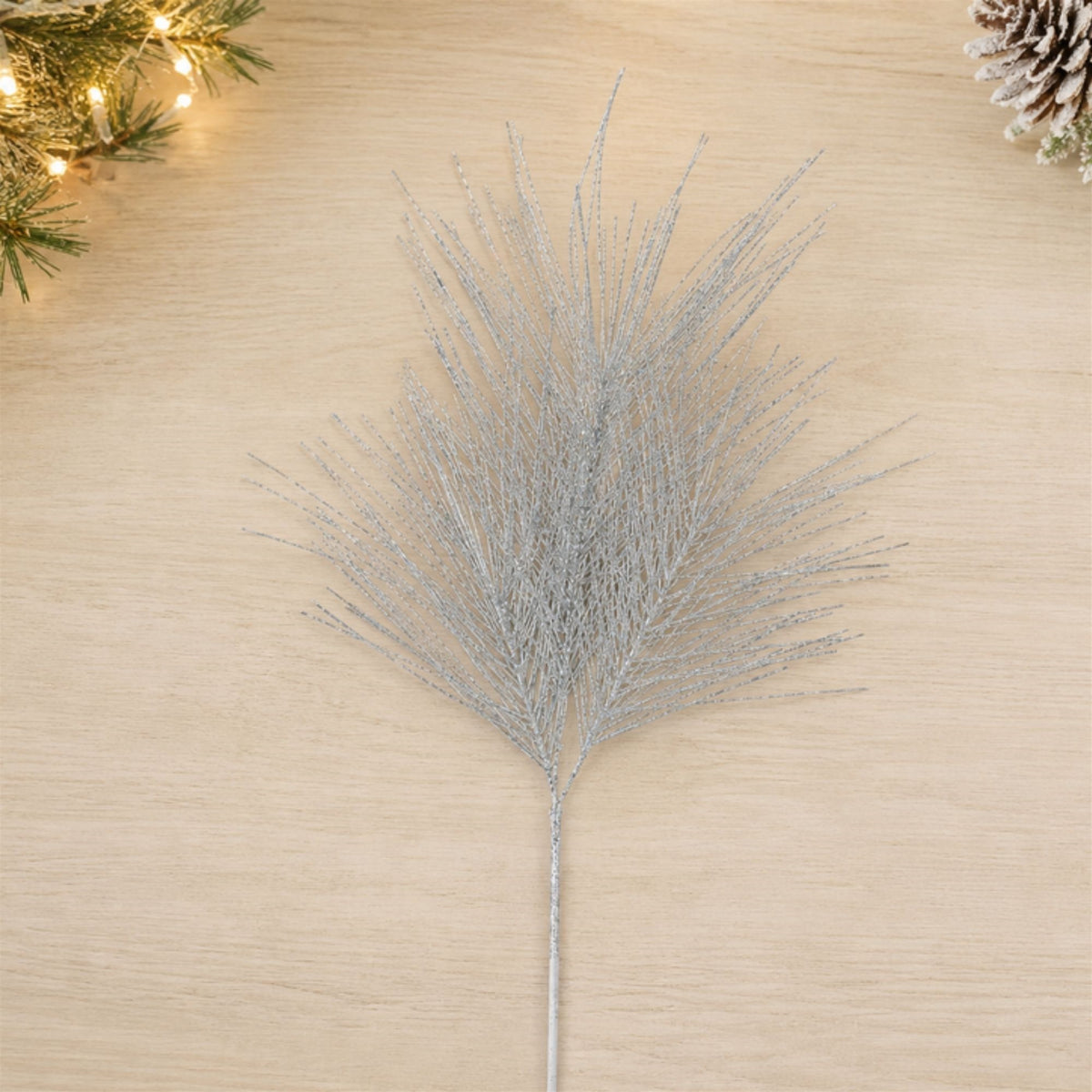 Silver Glittered Pine Sprays styled in holiday decor, faux Christmas spray arrangement idea