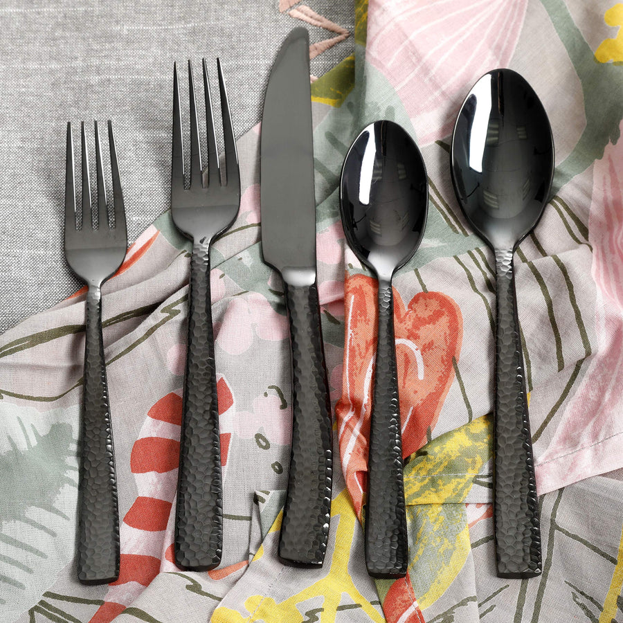 Gibson Elite Stonehenge black flatware on a floral napkin