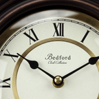 Bedford Clock Collection Contemporary Round Wall Clock with Pendulum – Black Oak & Gold Roman Numeral