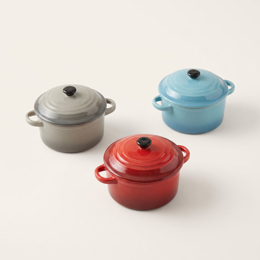 Crock-Pot Pembury 3 piece 9.6 oz mini casserole set in red, gray and light blue shown from a raised three-quarter studio angle