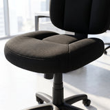 Close-up of an armless black fabric office task chair seat cushion and backrest, compact Elama computer desk chair