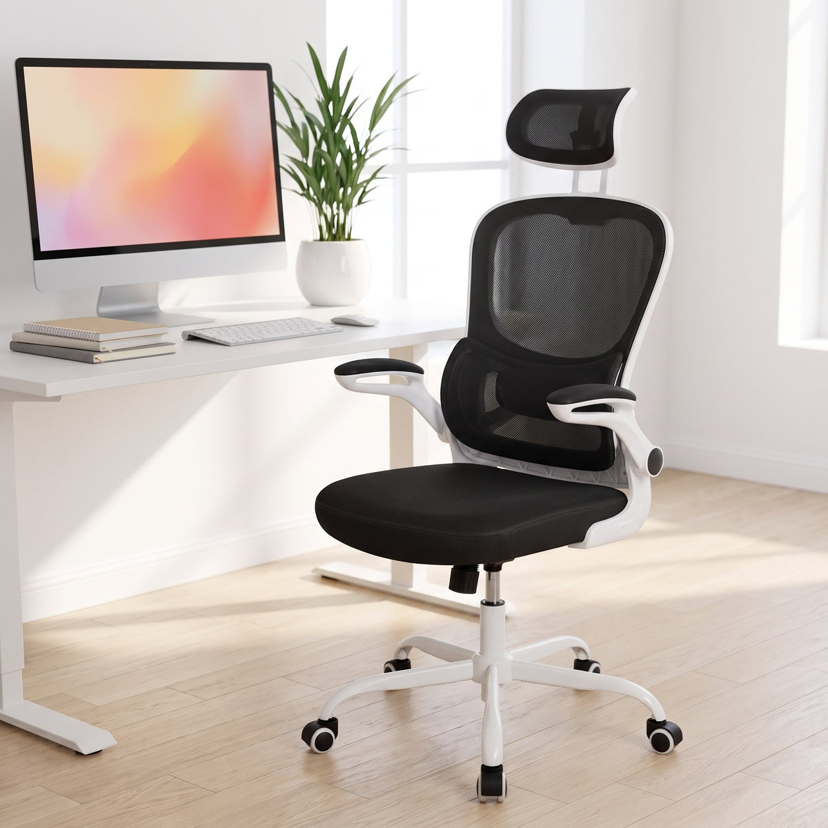 Elama white frame ergonomic mesh office chair with headrest at a white desk in a bright minimalist home office