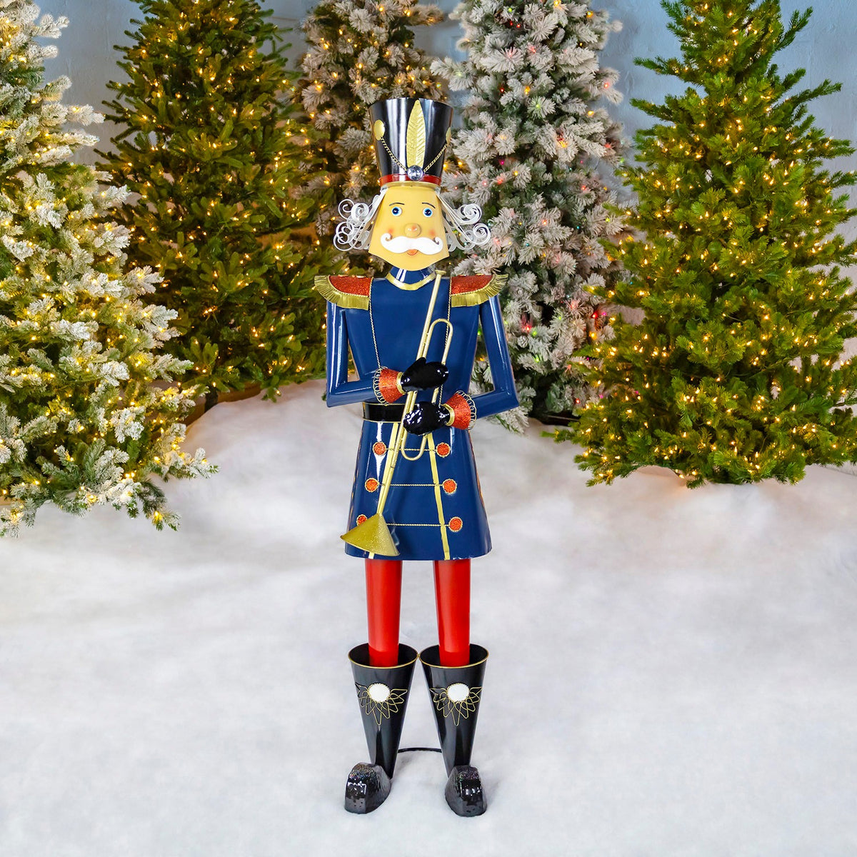 59 inch blue iron Christmas nutcracker playing a trumpet, glossy finish with gold details