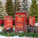 Set of three red iron Letters to Santa Christmas mailboxes with gold lettering and green holly