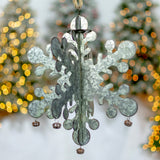 Six hanging galvanized silver metal snowflakes with jingle bells and manila rope