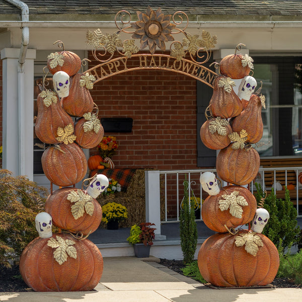 9.6 foot iron Happy Halloween walk through arch with stacked pumpkin and skull pillars, purple lights, and gold leaf accents