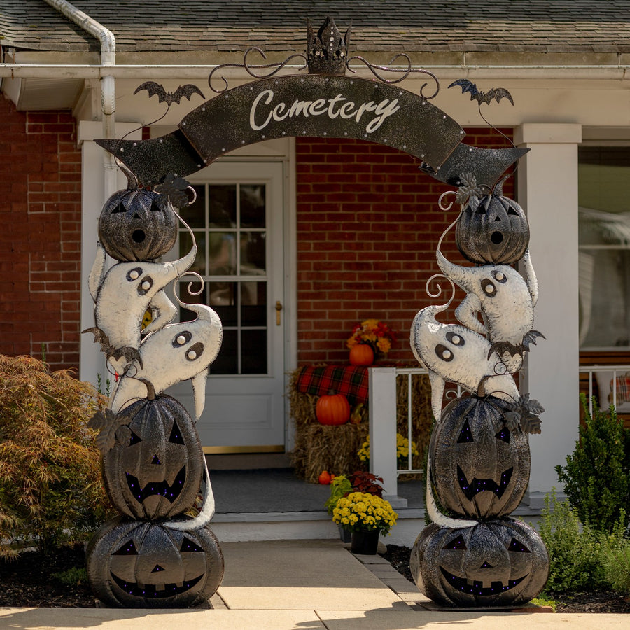 9.4 foot iron Halloween cemetery arch with a marquee lit Cemetery sign, black glitter jack-o-lanterns, and white ghosts
