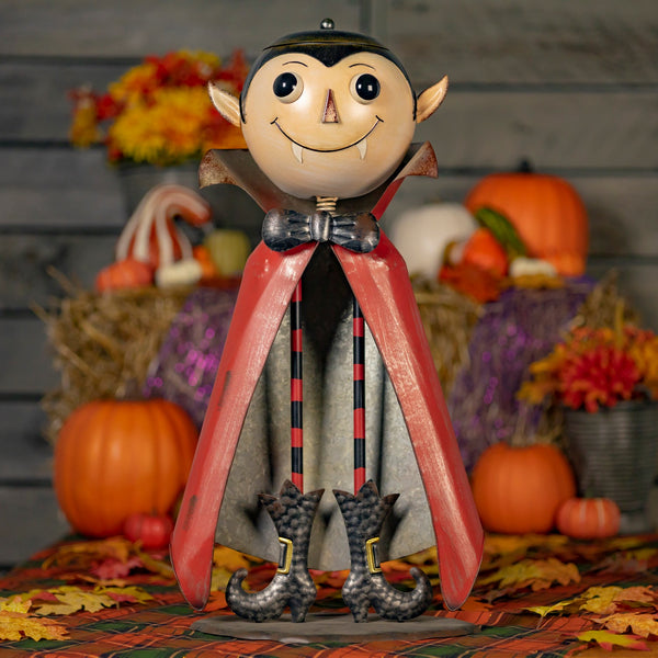 Big head iron vampire figurine with a lidded candy dish head on long skinny legs, hand painted