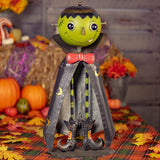 Big head iron Frankenstein monster figurine with a lidded candy dish head on long skinny legs