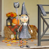 Big eyed iron witch girl statue holding an owl head broomstick, hand painted distressed matte finish