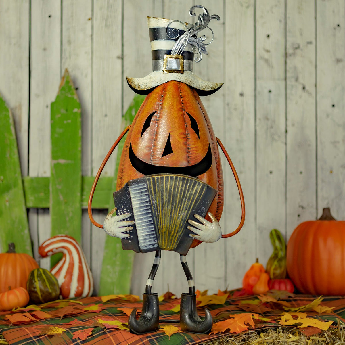 30.5 inch hand painted iron jack-o-lantern playing an accordion, orange, black, and white with glitter
