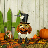 Iron masked jack-o-lantern figurine named Prospero, orange and black with metallic gold details