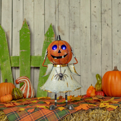 Iron jack-o-lantern ghost figurine in orange and white matte with purple LED lights