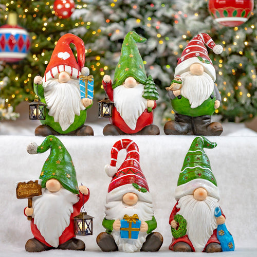 Set of six hand painted Christmas garden gnomes with white beards and red and green hats