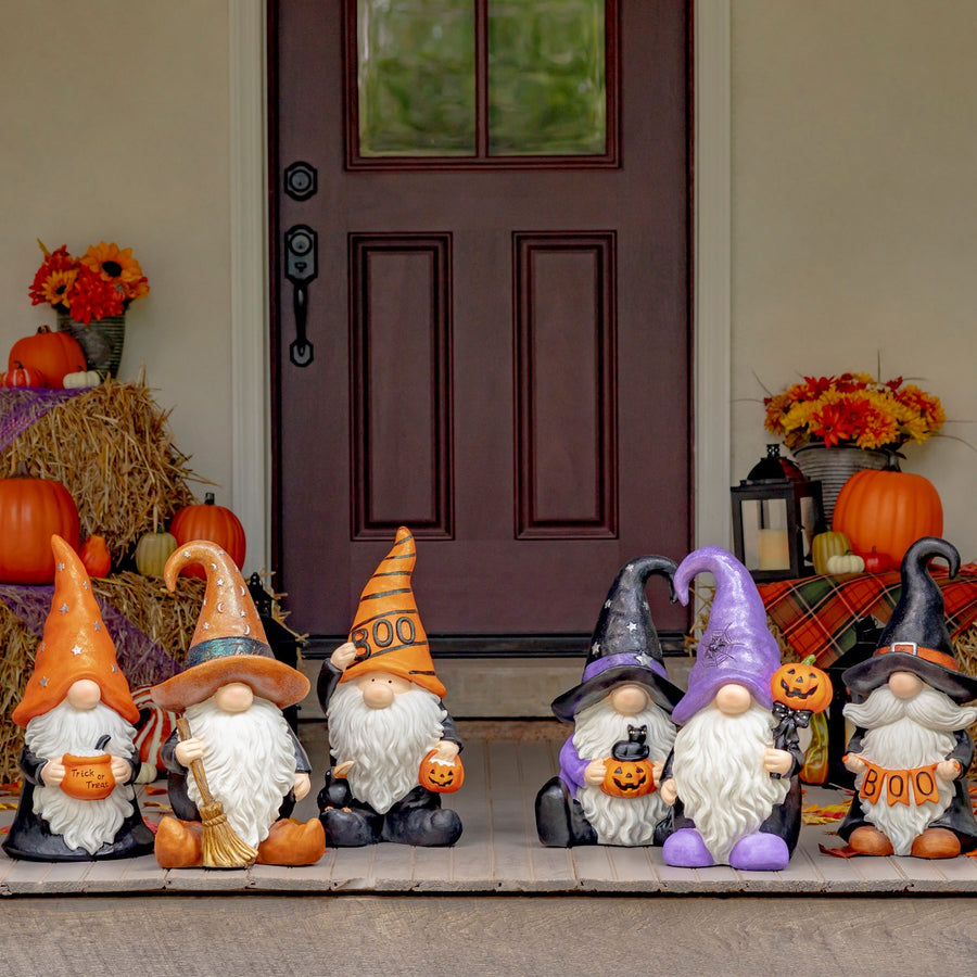 Six hand painted Halloween garden gnomes, wizards, witches, and a warlock in purple, orange, and brown hats