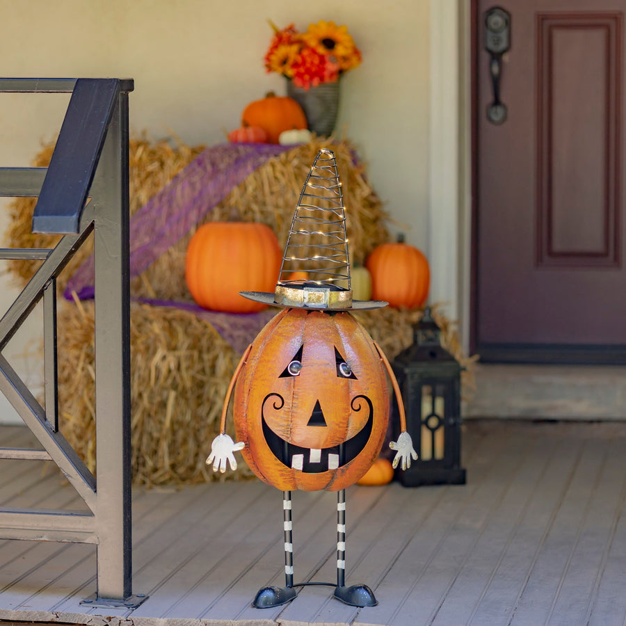 31.5 inch hand painted iron jack-o-lantern with a lit spiral LED witch hat, orange and black
