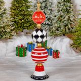 Tall iron Christmas ornament display tower hand painted red, black, and white with gold trim