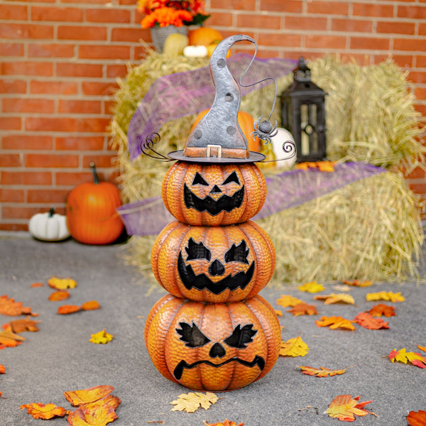 31 inch hand painted iron jack-o-lantern totem of stacked pumpkin faces, glossy orange and black